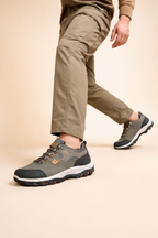 Grey men's all-terrain hiking shoes with a reinforced toe
