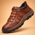 Brown men's hand-stitched casual shoes with a cushioned sole