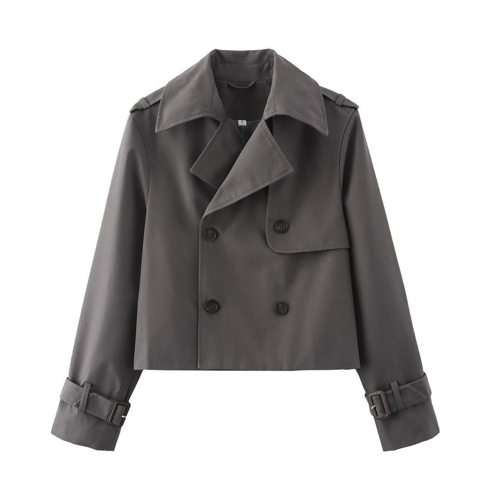 Short double-breasted trench coat with belt, product still life