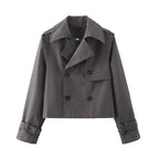 Short double-breasted trench coat with belt, product still life