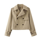 Short double-breasted trench coat with belt, product still life