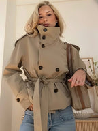 Short double-breasted trench coat with stand collar and tie belt