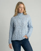 Women's light blue chunky cable knit pointelle roll neck jumper