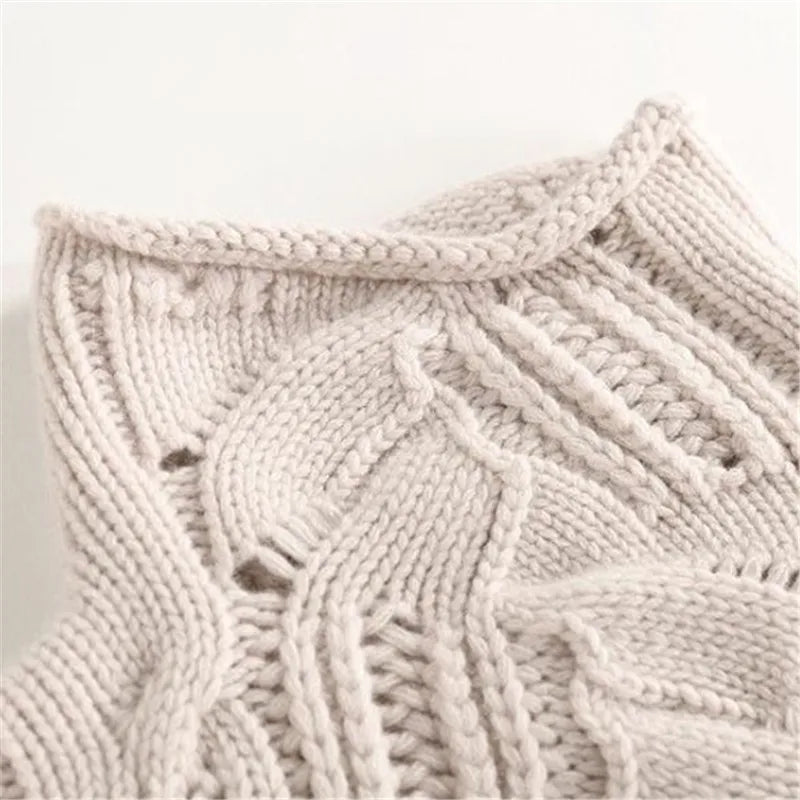 Women's chunky cable knit pointelle roll neck jumper