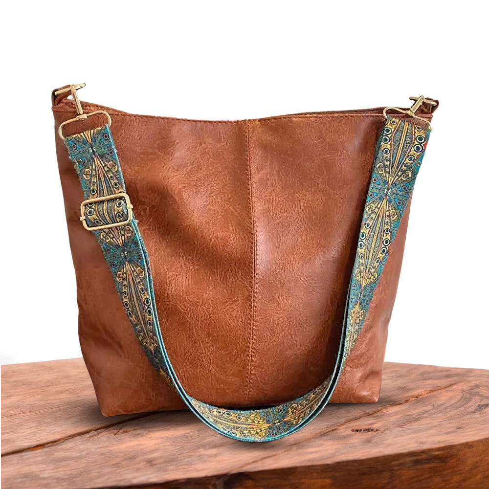 Tote bag with decorative strap detail, product still life