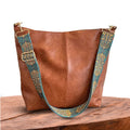Tote bag with decorative strap detail, product still life