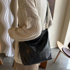 Tote bag with decorative strap detail, product still life
