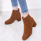Suede ankle boots with block heel and side zip, product still life