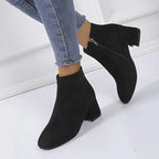 Suede ankle boots with block heel and side zip, product still life