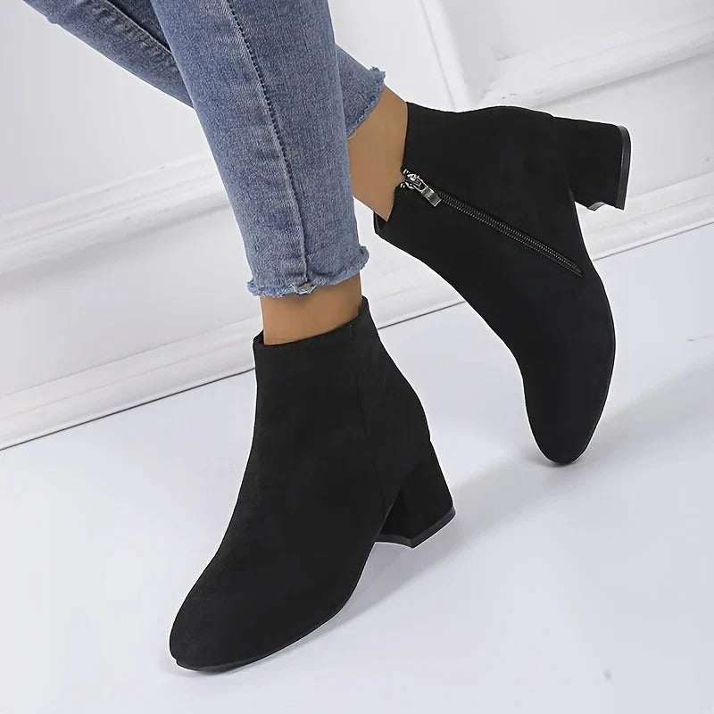 Suede ankle boots with block heel and side zip, product still life