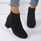 Suede ankle boots with block heel and side zip, product still life