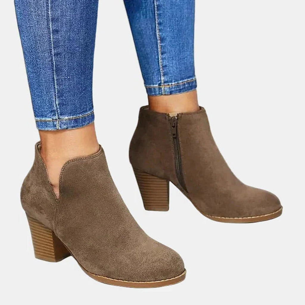 Suede ankle boots with block heel and side zip, product still life