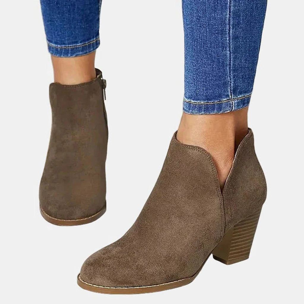 Suede ankle boots with block heel and side zip, product still life
