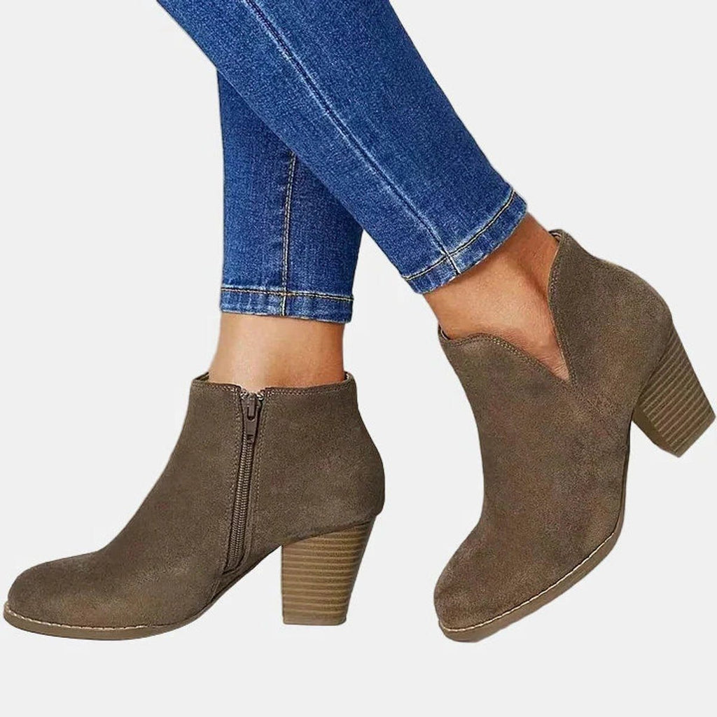 Suede ankle boots with block heel and side zip, product still life