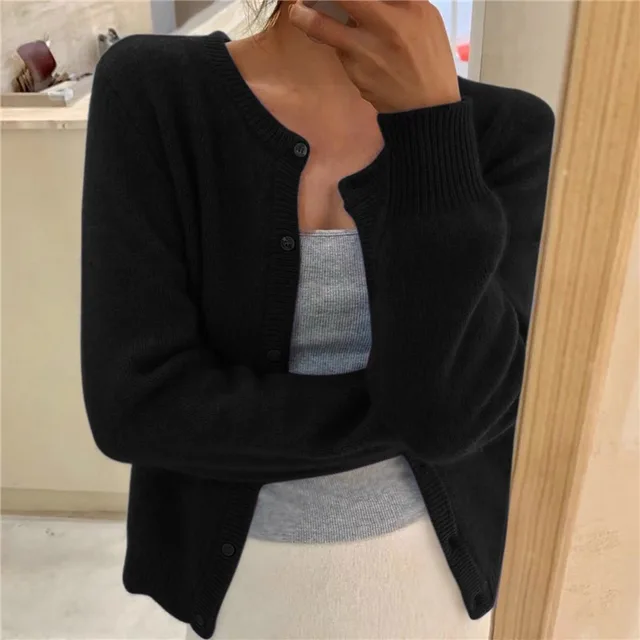 Grey V-neck knit cardigan with a loose fit for transitional layering