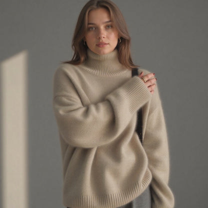 Beige oversized cashmere roll neck jumper with an oversized, cosy drape