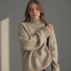 Khaki oversized cashmere roll neck jumper with an oversized, cosy drape