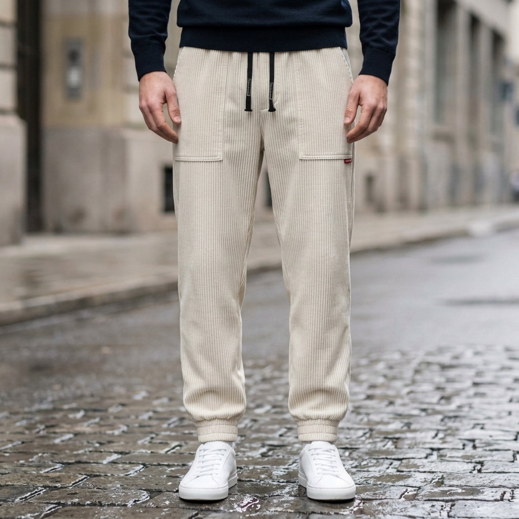 Men's mustard yellow corduroy joggers with a tapered fit and cuffed hem