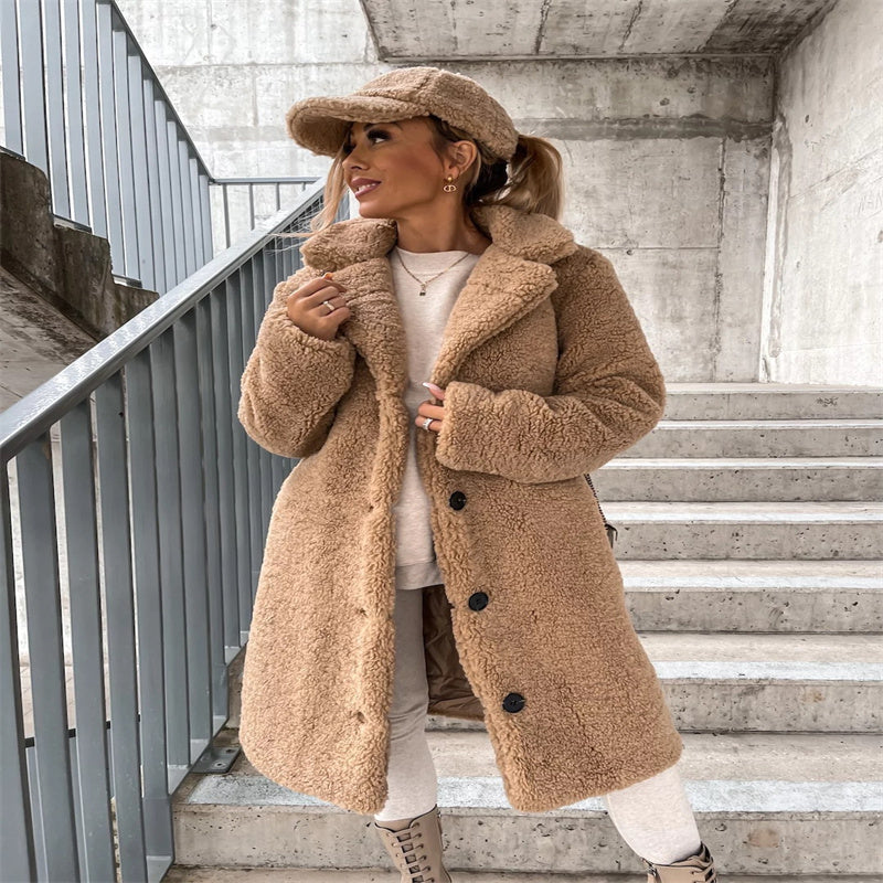 Teddy coat with notched collar and button front, product still life