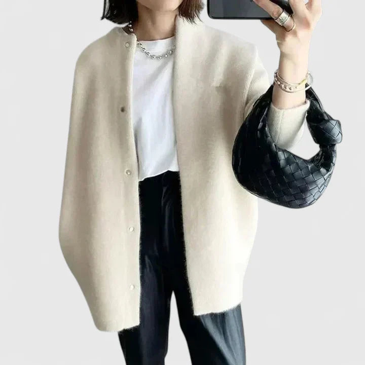 Women's green tailored jacket with a smart button-front closure design