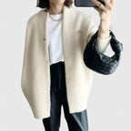Women's green tailored jacket with a smart button-front closure design