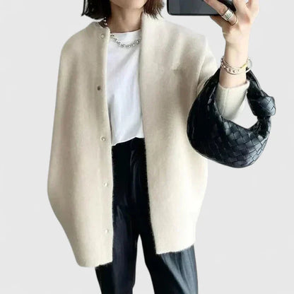 Women's green tailored jacket with a smart button-front closure design