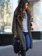 Women's black longline borg teddy coat with a plush, insulated finish