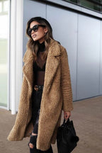 Women's black longline borg teddy coat with a plush, insulated finish