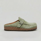 Suede-look clogs with adjustable buckle strap, product still life