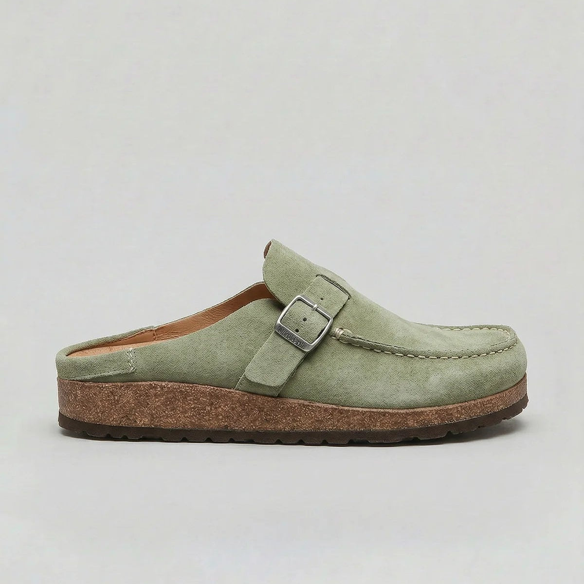 Suede-look clogs with adjustable buckle strap, product still life