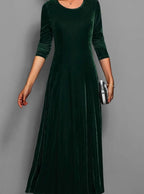 Women's dark green velvet long sleeve maxi dress with an A line skirt