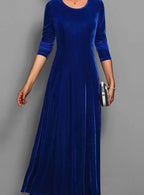 Women's blue velvet long sleeve maxi dress with an A line skirt