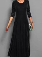 Women's black velvet long sleeve maxi dress with an A line skirt