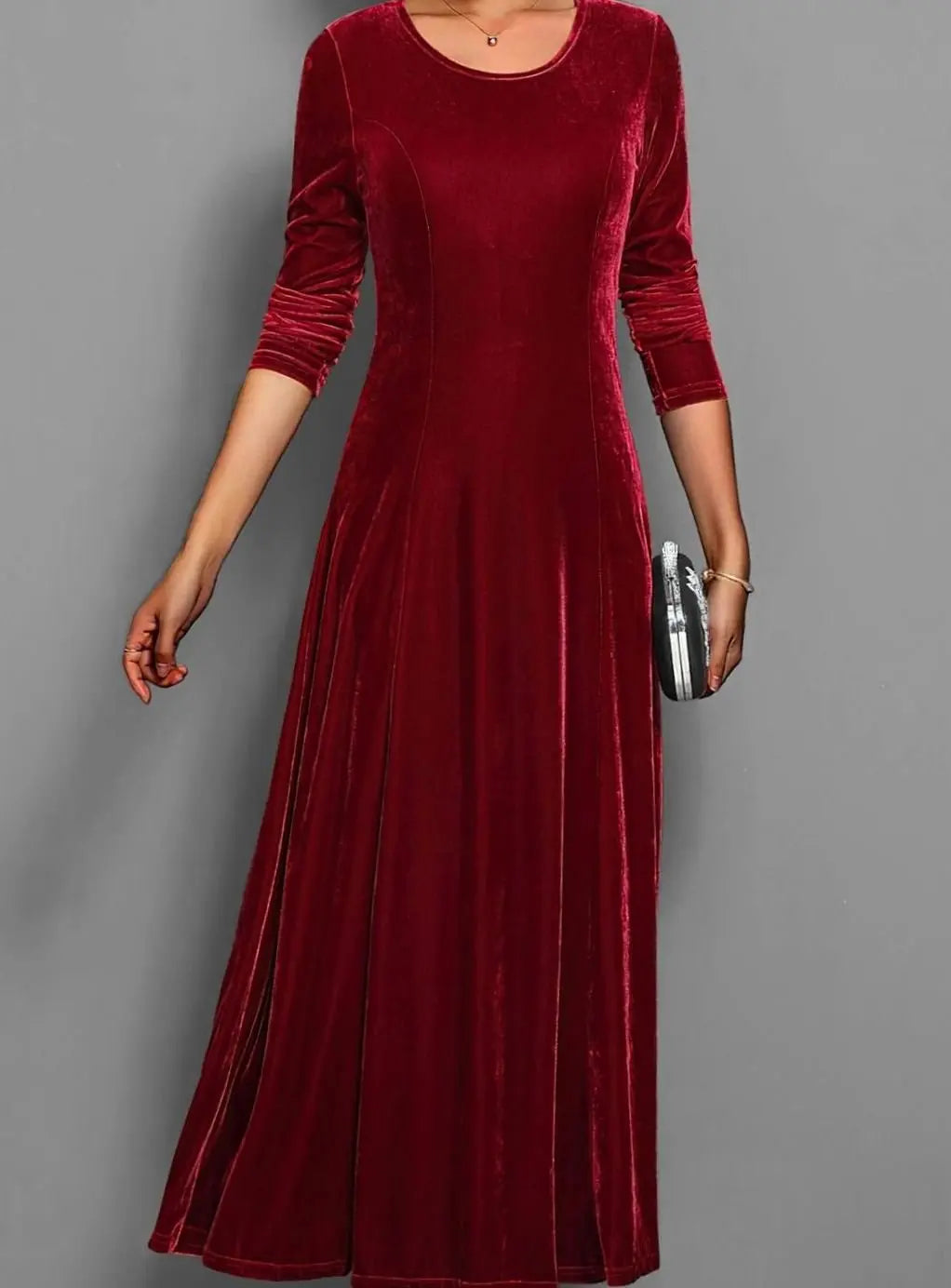 Women's burgundy velvet long sleeve maxi dress with an A line skirt
