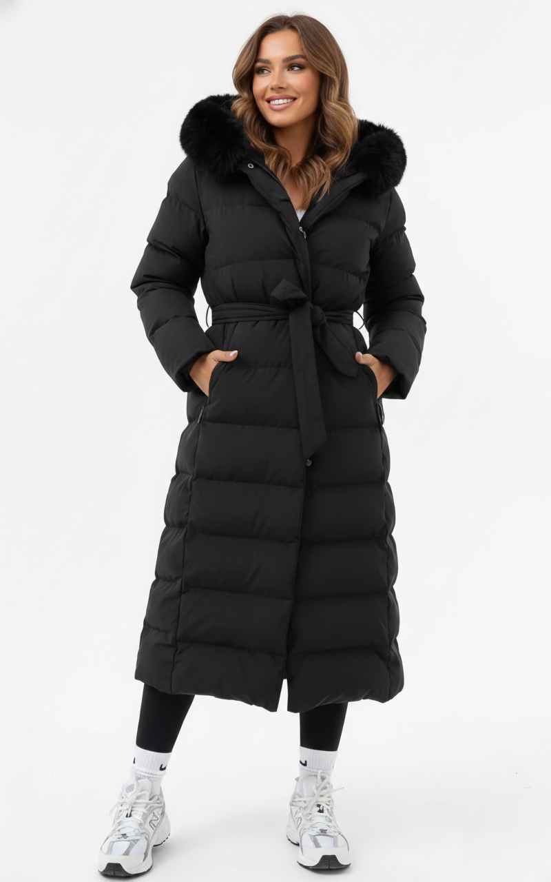 Women's black belted longline puffer coat with a faux fur collar