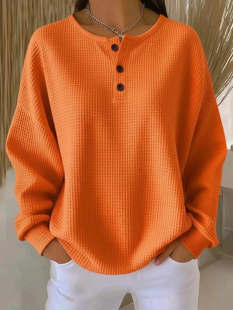 Women's orange oversized waffle knit henley sweatshirt