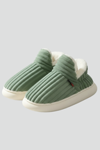 Slippers with ribbed upper and soft inner lining, product still life