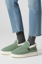 Slippers with ribbed upper and soft inner lining, product still life