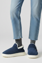 Slippers with ribbed upper and soft inner lining, product still life