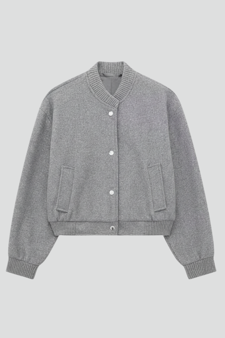 Cropped jacket with snap fastening and ribbed cuffs, product still life
