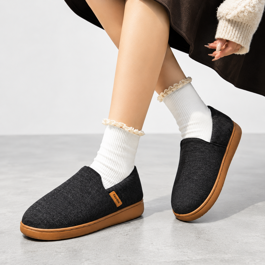 Fleece-lined slippers with cushioned footbed and hard outsole, product still life