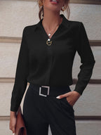 Women's black long sleeve blouse in a slim, tailored office fit