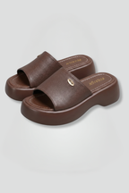 Leather open-toe mule slippers with platform sole, product still life
