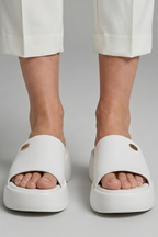Leather open-toe mule slippers with platform sole, product still life