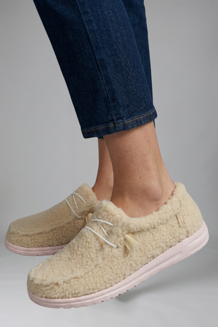 Close-up of stitched seam detail on slip-on loafers