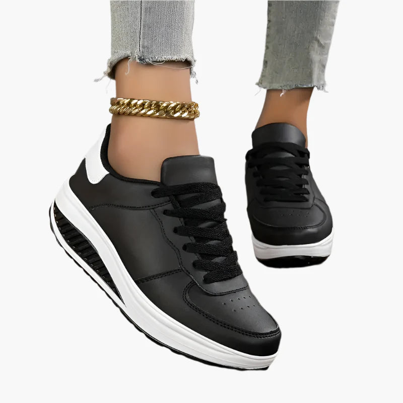 Women's black air cushion trainers with a lightweight flexible sole