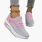 Women's black air cushion trainers with a lightweight flexible sole
