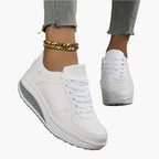 Women's black air cushion trainers with a lightweight flexible sole