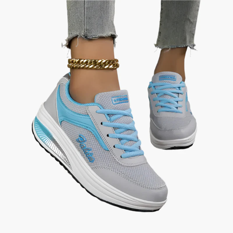 Women's black air cushion trainers with a lightweight flexible sole