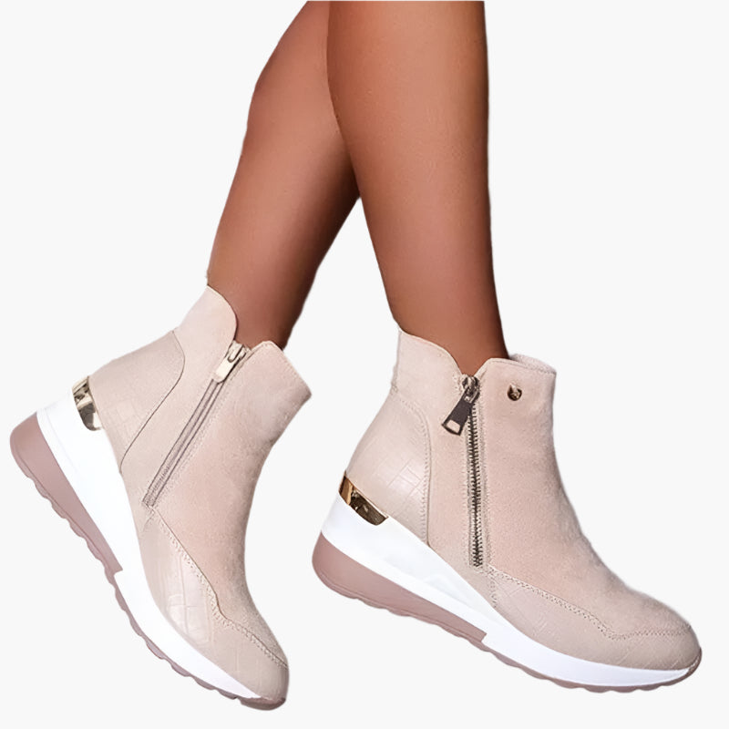Women's beige wedge ankle boots with a side zip fastening